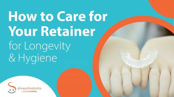 A pair of hands with gloves holding a retainer with text "How to Care for Your Retainer for Longevity & Hygiene" 